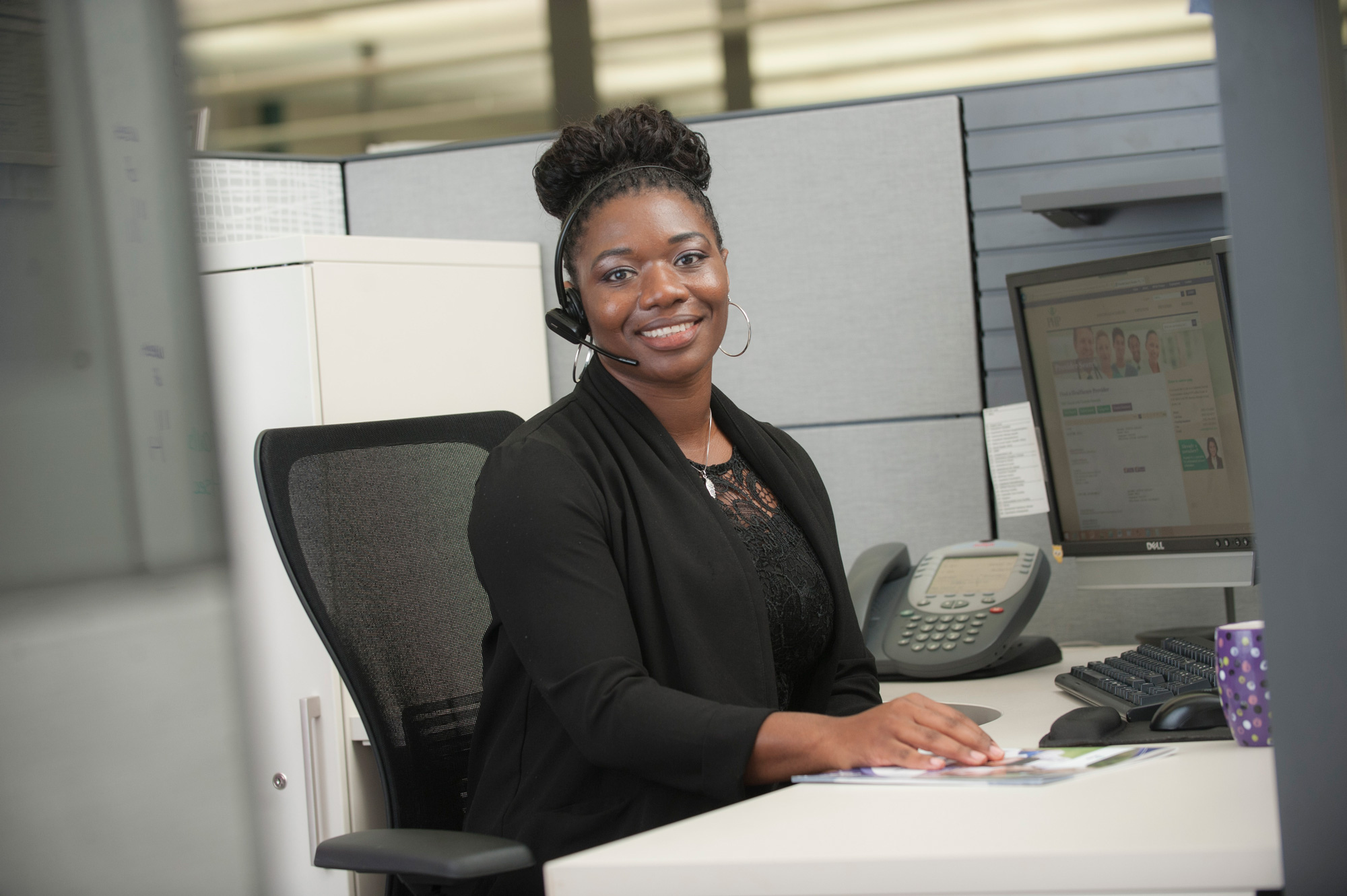A PHP customer support representative is on the phone with a customer.